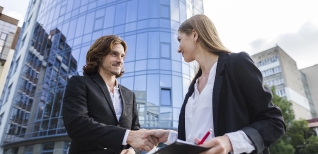 business-man-woman-shaking-hands
